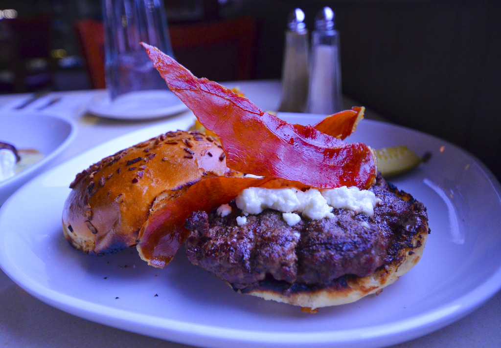 Black angus burger with crispy proscuitto and bruleed goat cheese, homemade pickle, and potato hash made from sweet and regular potatoes