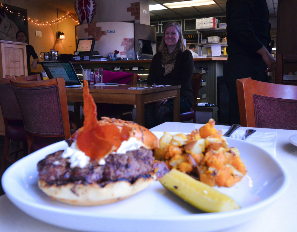 black angus burger with crispy proscuitto and bruleed goat cheese, homemade pickle, and potato hash made from sweet and regular potatoes.